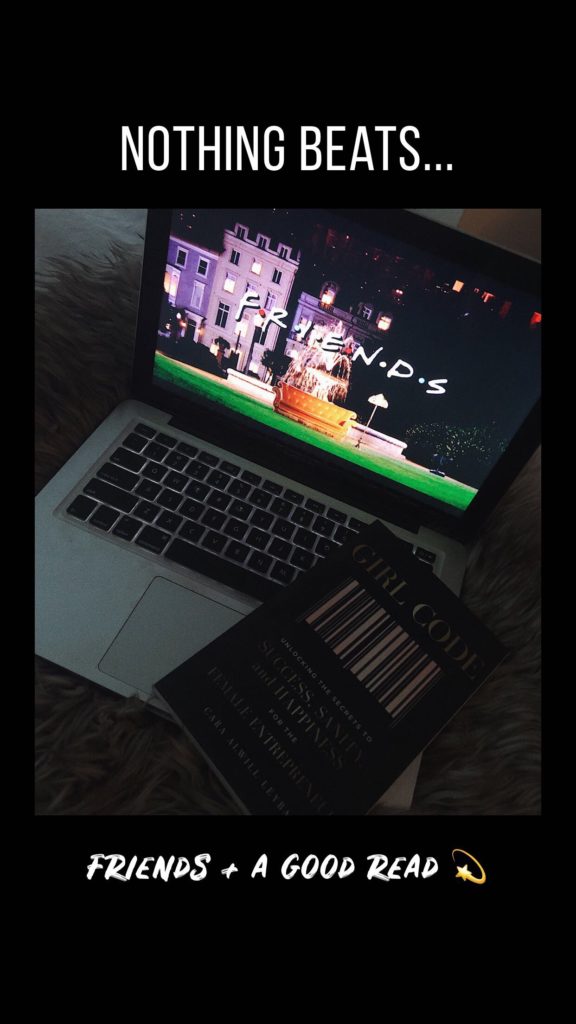 Laptop open with book