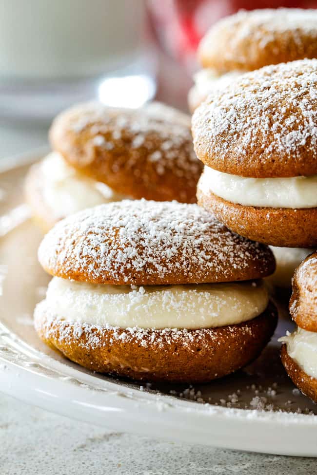 Gingerbread Whoopie Pies - everyone always begs me for this recipe! Super soft gingerbread cookies stuffed with luscious cream cheese filling! You won't be able to have just one!